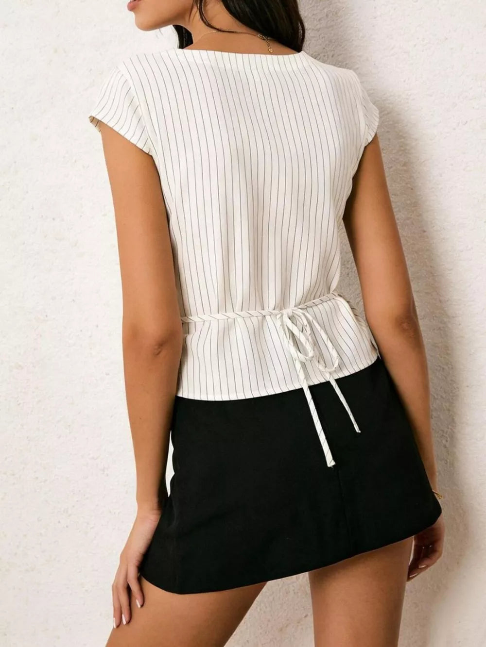 White pinstripe short sleeve shirt with tie waist detail.