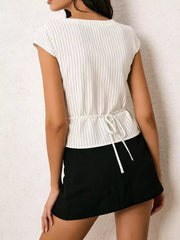 White pinstripe short sleeve shirt with tie waist detail.