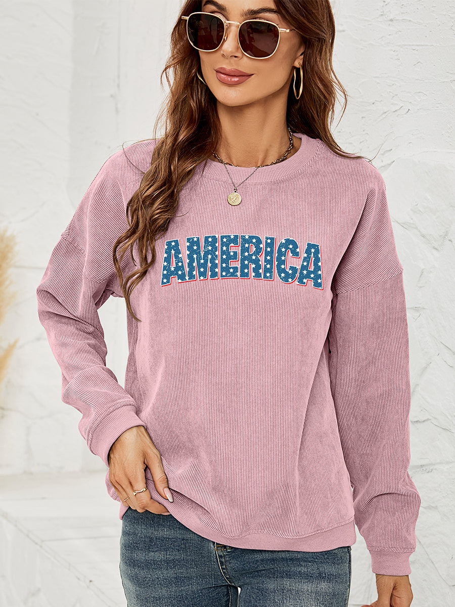 Dusty Pink corduroy sweatshirt with "AMERICA" graphic, crewneck, long sleeves.