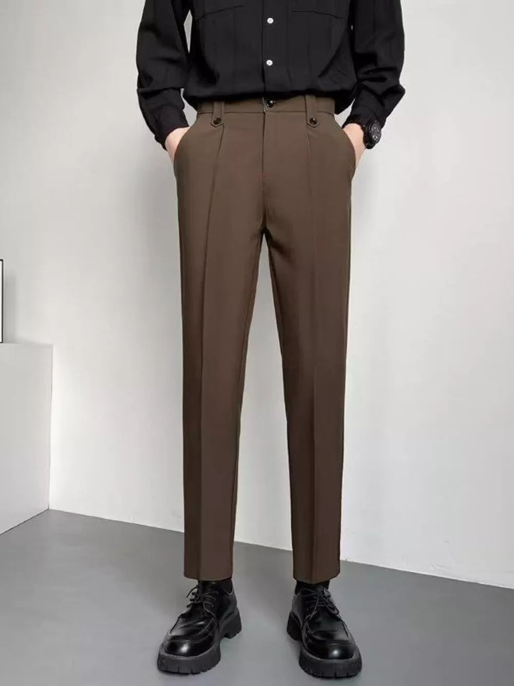 Men's coffee brown slim fit ankle-length trousers with double button waist detail.