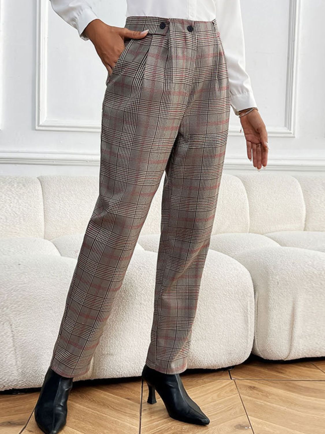 High-waisted taupe plaid trousers with pleat detail and button closure.