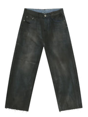 Washed denim wide-leg trousers in dark with a raw hem.