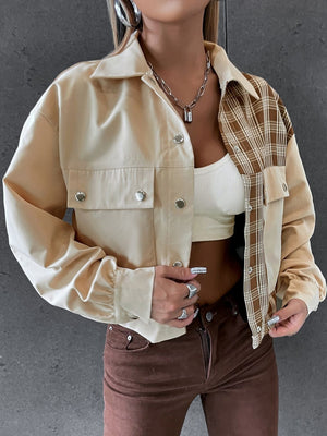 Beige panelled jacket with faux leather and plaid sleeves, buttoned front and pockets.