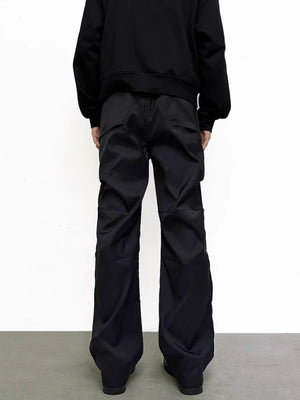Men's black pocketed sweatpants with a relaxed fit and cargo-style pockets.