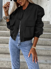 Black faux leather bomber jacket with sculpted sleeves and chest pockets.