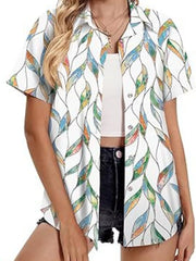 White short sleeve button-up shirt with a colorful leaf print.