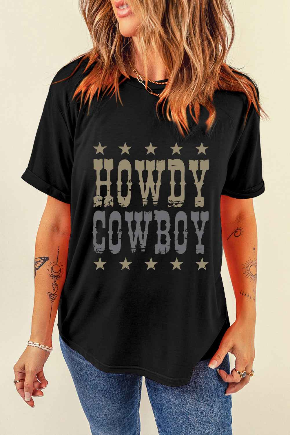 Black graphic t-shirt with Howdy Cowboy text and stars pattern