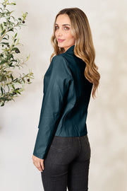 Biker-inspired faux leather jacket in Peacock Blue, with a stand collar and long sleeves.