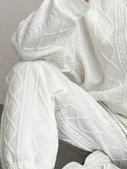 White cable knit loungewear set with textured pattern detail.