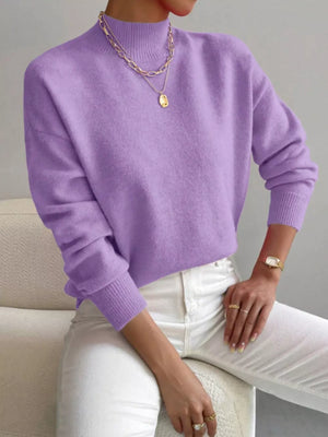 Lavender mock neck knit sweater with dropped shoulders, acrylic fabric, and ribbed cuffs.