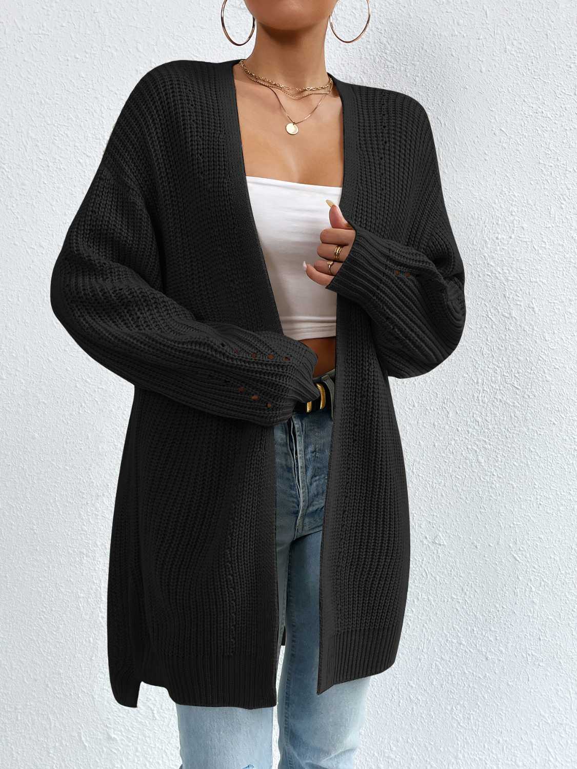 Black longline knit open cardigan with textured sleeves and a relaxed fit.