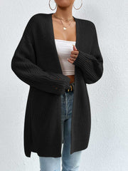 Black longline knit open cardigan with textured sleeves and a relaxed fit.