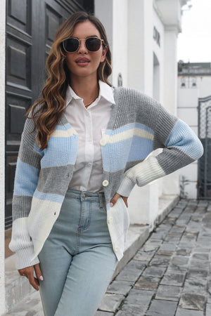 Horizontal stripe knit cardigan with button closure in grey, white, and light blue acrylic.