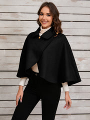 Black asymmetric button-front cape jacket with gold buttons and a collar.