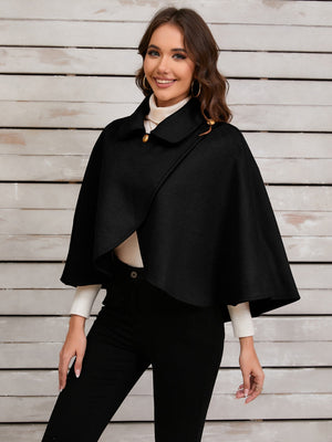 Black asymmetric button-front cape jacket with gold buttons and a collar.