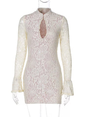 White lace cutout mini dress with flared sleeves and high neckline.