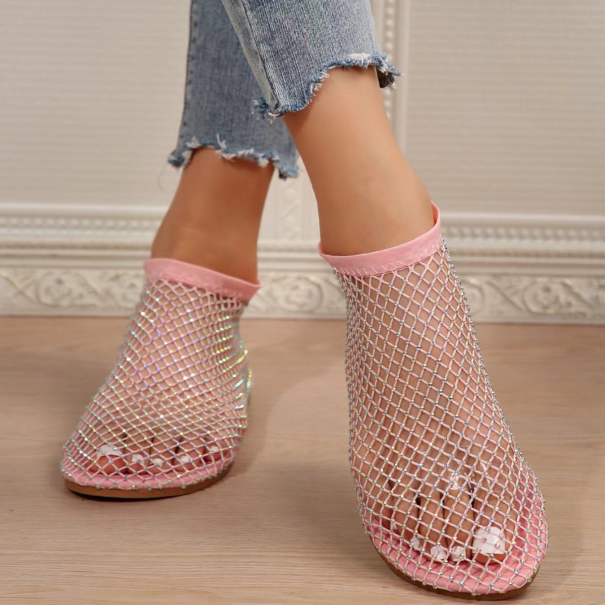 Pink mesh ankle socks with rhinestones and pink trim, worn with sandals.