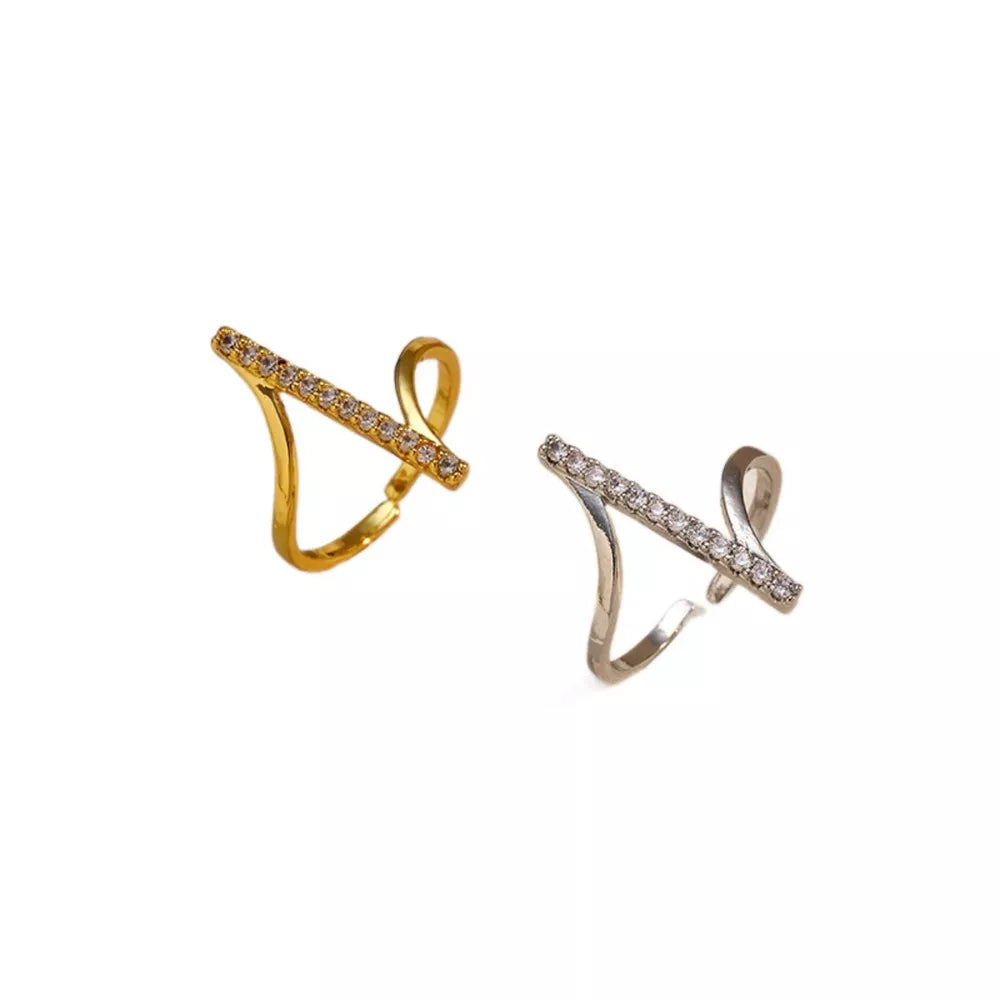 Contemporary gold and gray rings with rhinestone embellishments and abstract design.