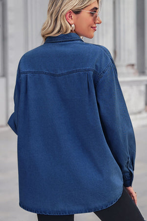 Oversized dark wash denim shirt with collared neck and buttoned front, shown from the back.