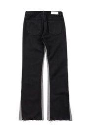 Black cotton bootcut jeans with contrast side panels and raw hem