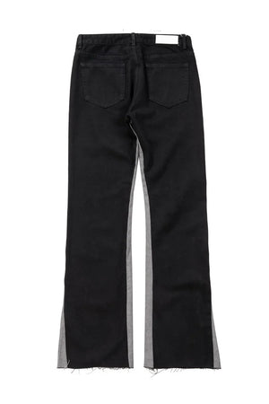 Black cotton bootcut jeans with contrast side panels and raw hem