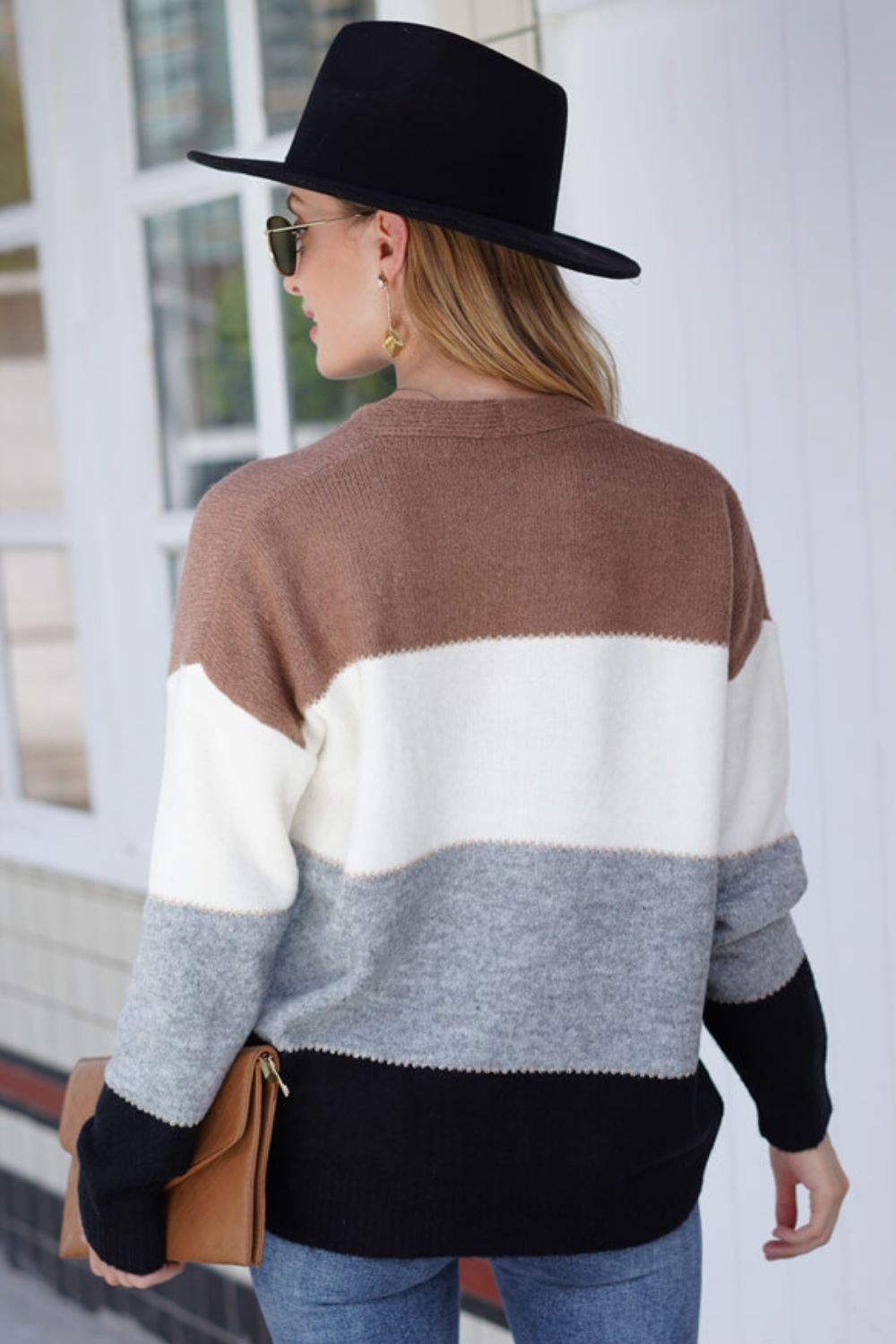 Colorblock acrylic cardigan with brown, white, grey, and black stripes.