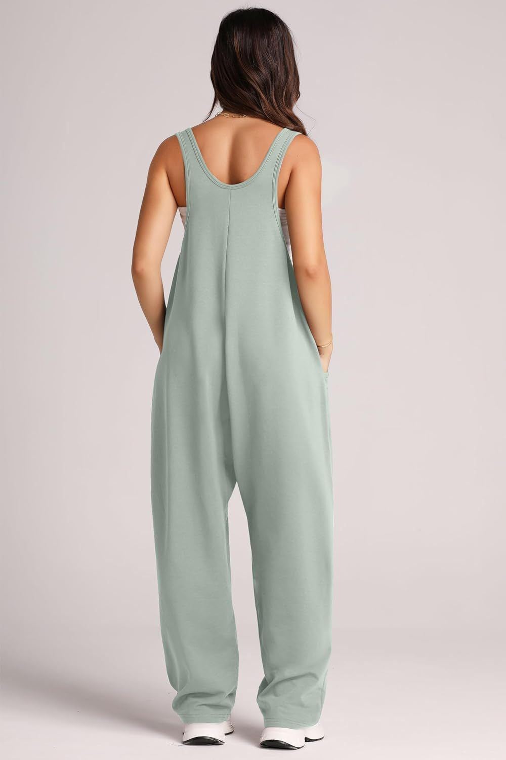 Relaxed fit tank jumpsuit in matcha green with side pockets and a scoop neckline.