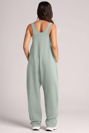 Relaxed fit tank jumpsuit in matcha green with side pockets and a scoop neckline.