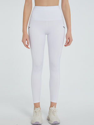 White pocketed leggings with a high waist and seam details.