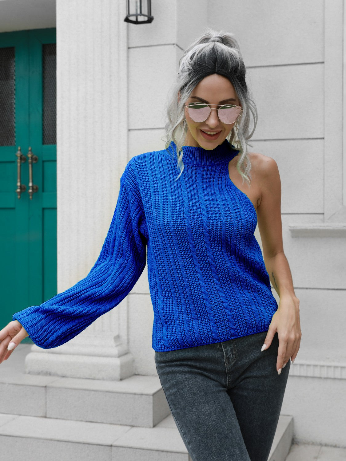 Royal blue acrylic cable knit sweater with asymmetric shoulder detail