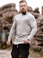 Light gray ribbed knit crewneck long sleeve muscle fit top with crew neckline.