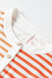 Colorblock stripe sleeveless jumpsuit with white collar and wooden buttons.