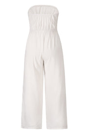 White bandeau tie-waist wide-leg jumpsuit with ruched bodice and cropped wide legs.