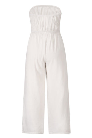 White bandeau tie-waist wide-leg jumpsuit with ruched bodice and cropped wide legs.