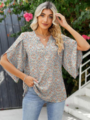 Floral print blouse with flutter sleeves and V-neck, made of 100% polyester.