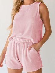 Chic sleeveless pink ribbed coord set with elastic waist shorts and pockets.
