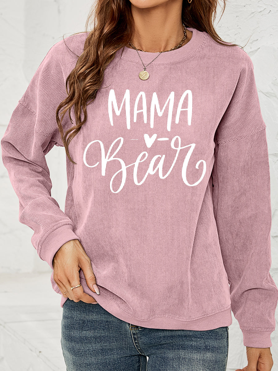 Textured corduroy sweatshirt in Dusty Pink with white "Mama Bear" graphic print.