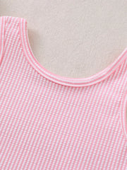 Pink striped seersucker one-piece swimsuit with ruffled trim.