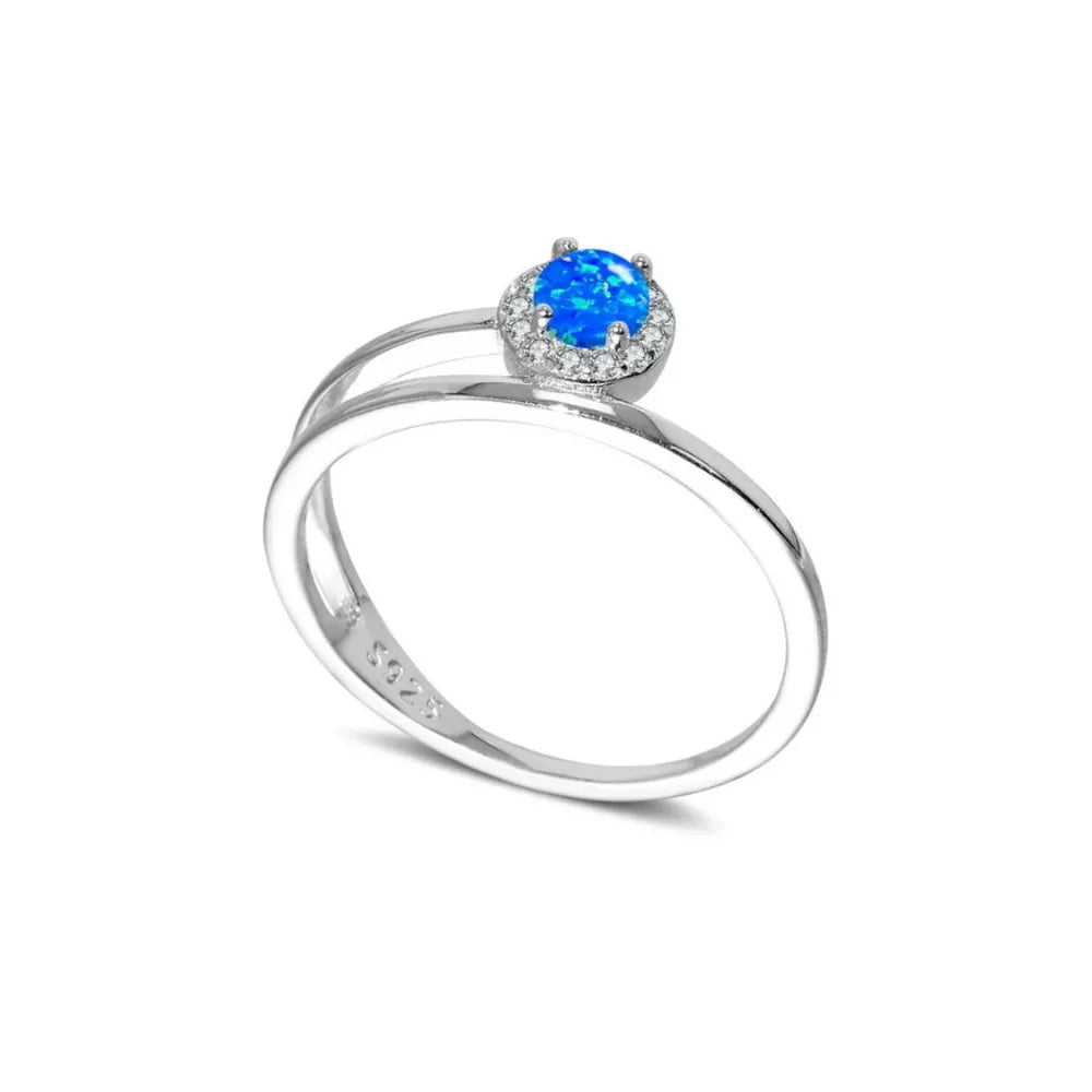 Silver ring with iridescent blue opal and diamond halo on double band