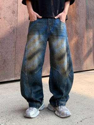 Men's dark distressed wide-leg denim jeans with a relaxed fit.