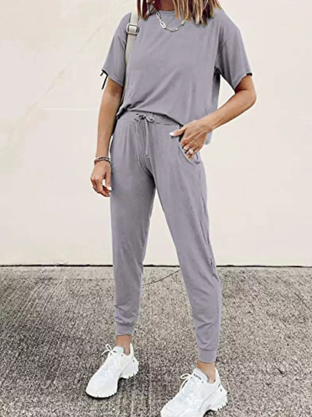 Grey cotton round neck top and jogger pants set with drawstring waist and pockets.