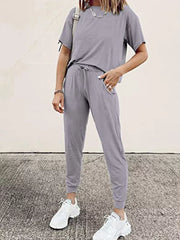 Grey cotton round neck top and jogger pants set with drawstring waist and pockets.