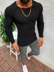 Black ribbed knit long sleeve sweater with crew neck and raglan sleeves.