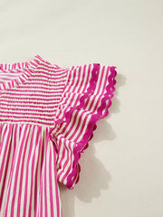 Shirred yoke blouse with pink and white stripes and ruffled sleeves.