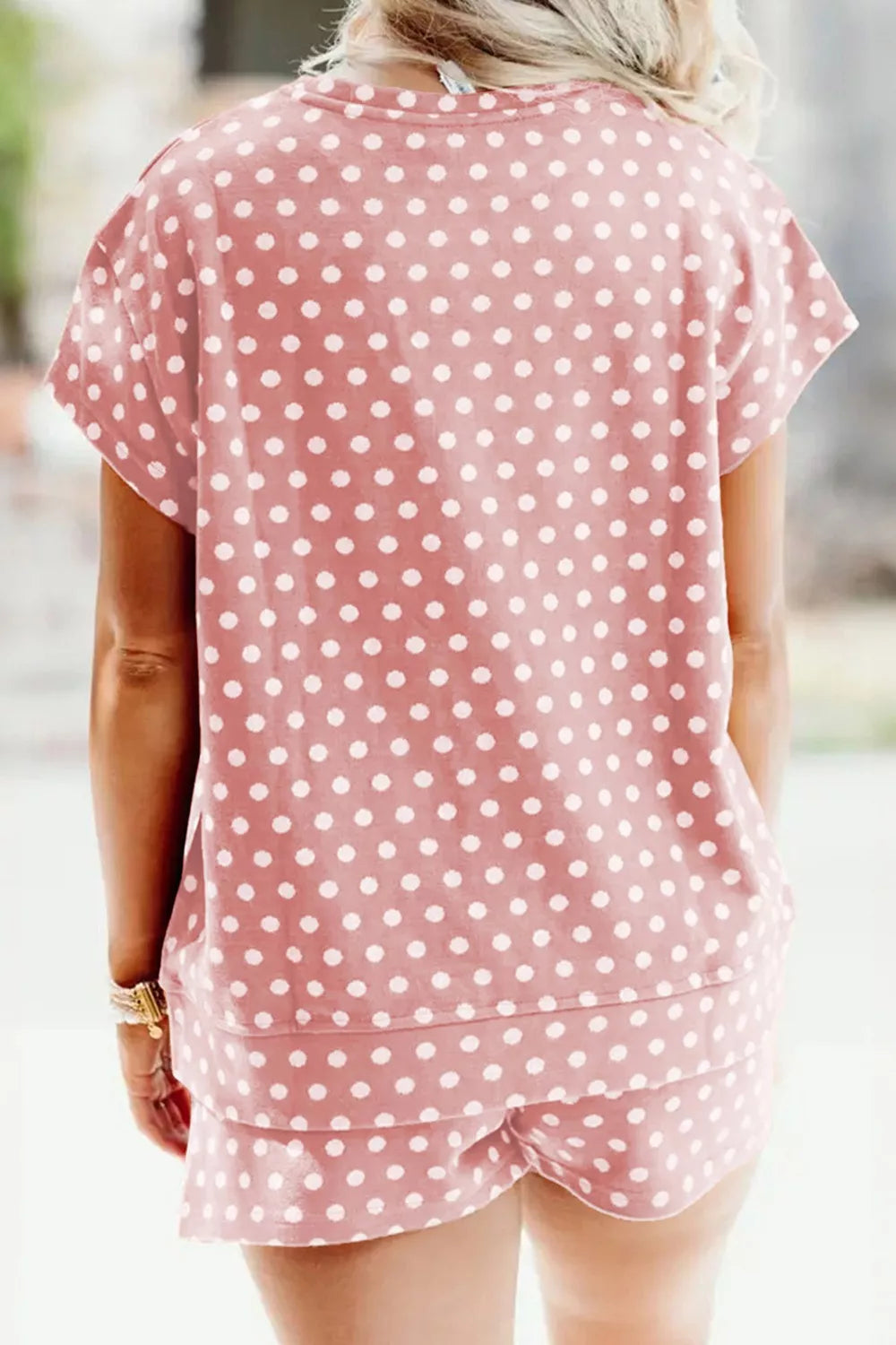 Pink polka dot tee and shorts set with short sleeves and elastic waist shorts.