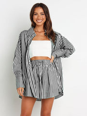Oversized black and white stripe shirting set with drawstring shorts and a long sleeve button-up shirt.