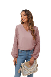 Dusty Pink V-neck blouse with textured pom-pom balloon sleeves.