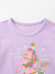 Lavender cotton toddler t-shirt with a pink unicorn graphic and text.