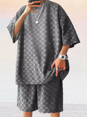 Men's dark gray textured checkered casual two-piece set with short sleeves and shorts.