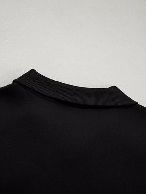 Black zip-up jacket collar detail with ribbed trim, comfortable cotton activewear.